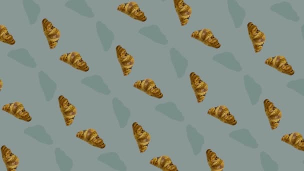 Colorful pattern of croissants. Seamless pattern with croissant. Top view. Realistic animation. 4K video motion — Vídeo de Stock