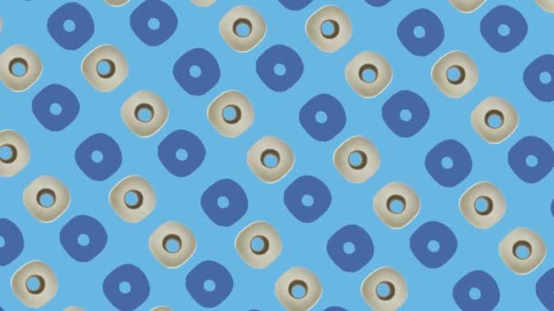 Colorful pattern of rolls of a white toilet paper isolated on blue background. Seamless pattern with toilet paper. Top view. Realistic animation. 4K video motion — Stockvideo