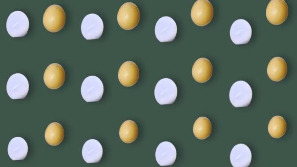 Colorful pattern of chicken eggs on green background. Seamless pattern with egg. Top view. Realistic animation. 4K video motion — Vídeo de Stock