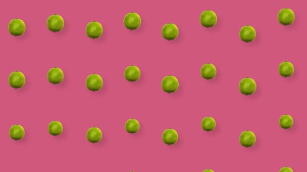 Patrón colorido de frutas de limas frescas sobre fondo rosa. Patrón sin costuras con cal. Animación realista. Movimiento de vídeo 4K — Vídeo de stock