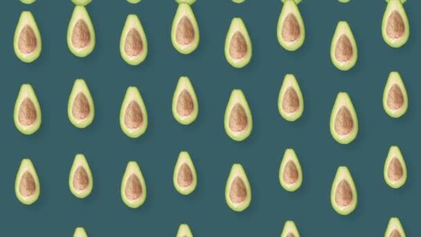 Colorful fruit pattern of fresh avocados. Top view. Seamless pattern with avocado. Realistic animation. 4K video motion — Vídeo de Stock