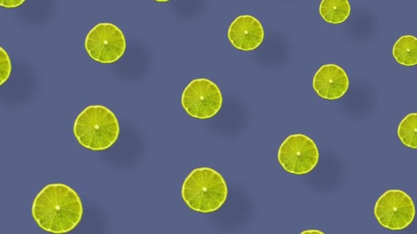 Kolorowy wzór owoców świeżych limonek z cieniami. Płynny wzór z plastrami wapna. Realistyczna animacja. Ruch wideo 4K — Wideo stockowe