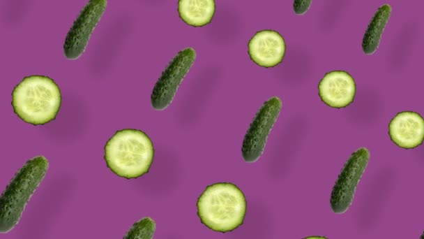 Colorful pattern of fresh cucumbers. Top view. Seamless pattern with cucumber slices. Pop art design. Realistic animation. 4K video motion — Stockvideo