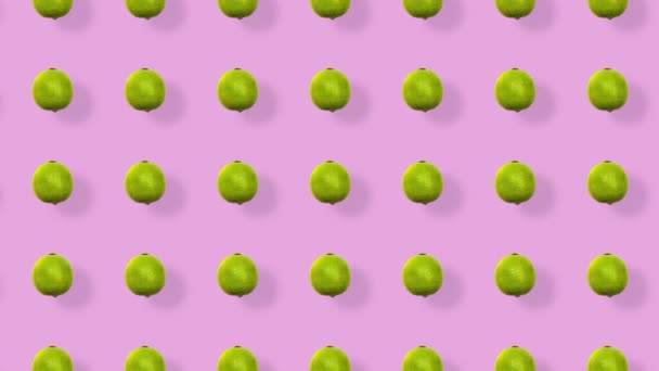 Modèle de fruits colorés de limes fraîches sur fond rose avec des ombres. Modèle sans couture avec de la chaux. Animation réaliste. Mouvement vidéo 4K — Video