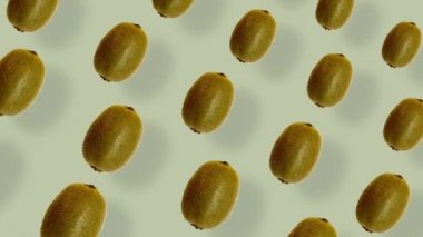 Taze kivinin renkli meyve deseni. Kiviyle kusursuz desen. Gerçekçi animasyon. 4K video hareketi