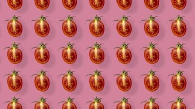 Pembe arka planda gölgeli taze kırmızı domates deseni. Kiraz dilimlenmiş domatesli kusursuz desen. Gerçekçi animasyon. 4K video hareketi