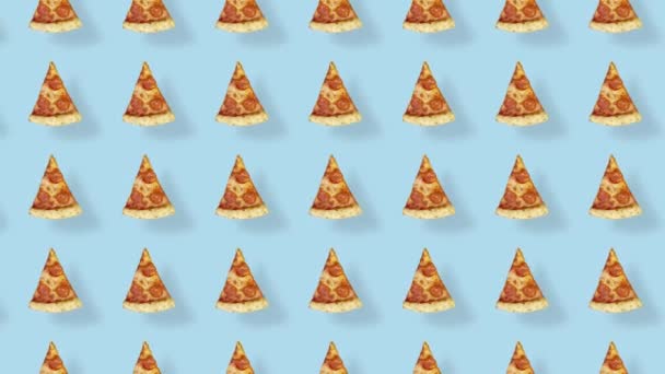 Colorful pattern of pizza isolated on blue background with shadows. Seamless pattern with pizza slices. Top view. Realistic animation. 4K video motion — Stockvideo