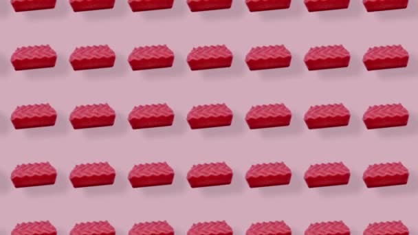 ピンクのキッチンスポンジのカラフルなパターン。スポンジでシームレスなパターン。最上階だ。現実的なアニメーション。4Kビデオモーション — ストック動画