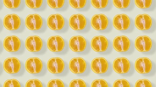 주황색의 화려 한 무늬. 위에서 본 모습. 열 대 과일의 개념은 아주 작습니다. 오렌지를 썰어 넣은 끈적끈적 한 무늬. 팝 아트 디자인. 리얼리티 애니메이션. 4K 비디오 모션 — 비디오