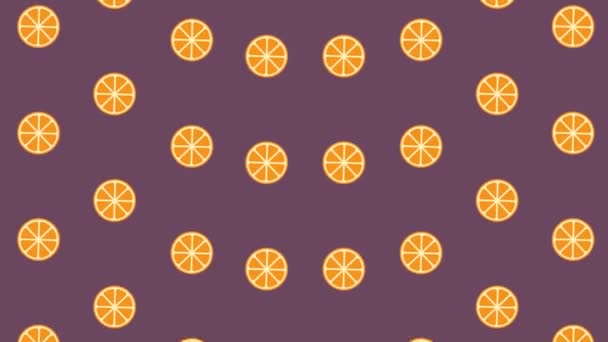 Цветной фруктовый узор из оранжевых ломтиков. Бесшовный рисунок с оранжевым. Вид сверху. 4K видео движение — стоковое видео