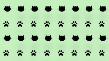 Yeşil arka planda siyah kedi kafalarının ve pençelerinin rengarenk deseni. Kedi pençesi ve yüzleri olan kusursuz bir desen. Hayvan silueti. 4K video hareketi