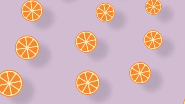 Kleurrijk fruitpatroon van sinaasappelschijfjes op pastelroze ondergrond met schaduwen. Naadloos patroon met oranje. Bovenaanzicht. 4K video beweging — Stockvideo