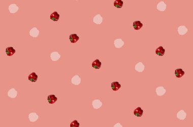 Pastel pembe arka planda taze kırmızı biber deseni. Bulgar kırmızı biberi. Üst Manzara. Düz yatıyordu. Pop sanat tasarımı