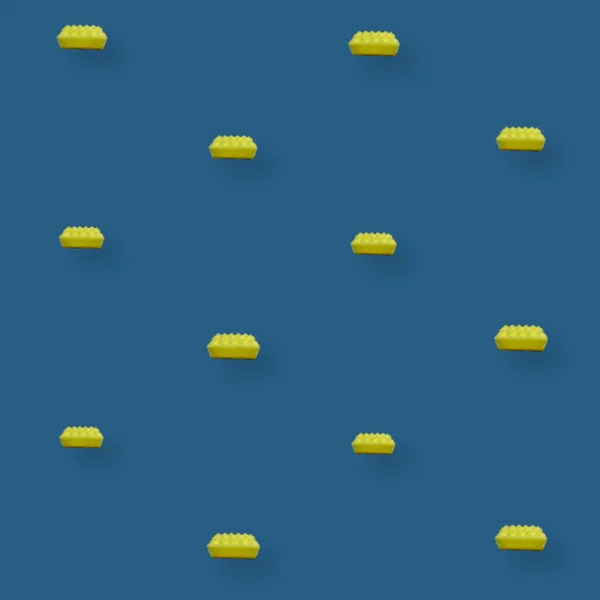 Buntes Muster gelber Küchenschwämme auf blauem Hintergrund. Ansicht von oben. Flach lag er. Pop-Art-Design — Stockfoto