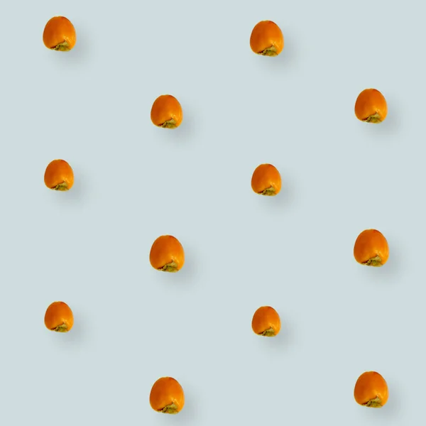 Barevný vzor ovoce čerstvých persimonů na světle šedém pozadí. Horní pohled. Ležel. Pop art design — Stock fotografie