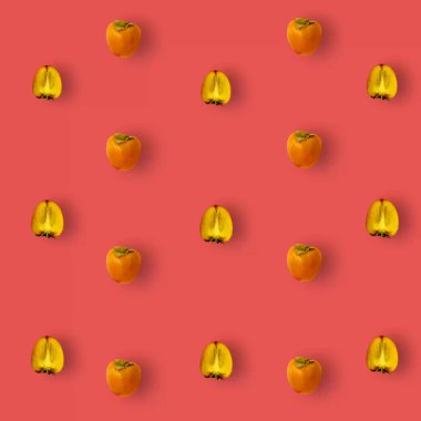 Kırmızı arka planda taze hurma renkli meyve deseni. Üst Manzara. Düz yatıyordu. Pop sanat tasarımı