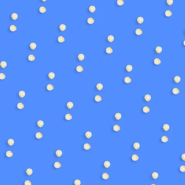 Colorful pattern of white zephyr on blue background. Marshmallow. Top view. Flat lay. Pop art — Stock Photo, Image