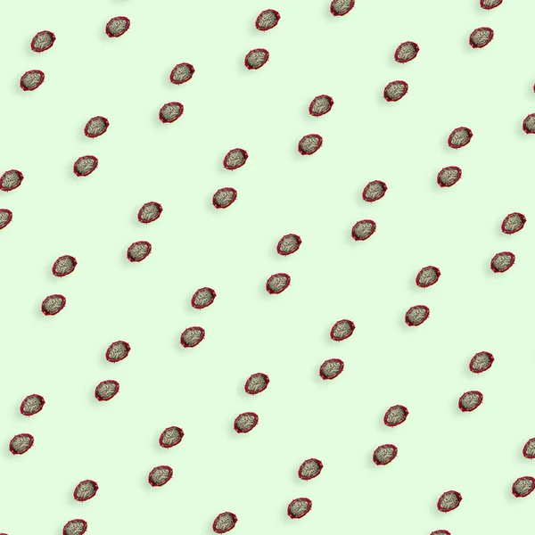 Patrón colorido de fruta fresca de dragón sobre fondo verde claro. Pitaya. Vista superior. Acostado. Diseño de arte pop —  Fotos de Stock