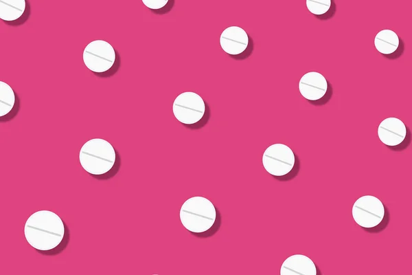 Padrão colorido de pílulas no fundo rosa com sombras. Padrão sem costura com comprimidos. Conceito de medicina, farmácia e saúde — Fotografia de Stock