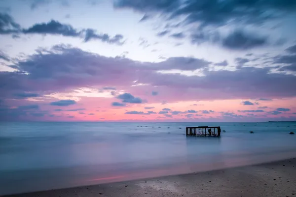 Tropical Beach with Empty Cage in the Sea at Sunset — Stock Photo, Image