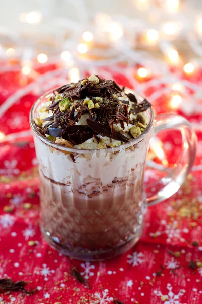 Hot chocolate with whipped cream, chocolate crunches and pistachio — Stock Photo, Image