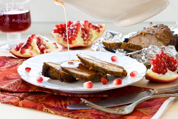 Roasted meat with pomegranat sauce, selective focus on sauce — Stock Photo, Image