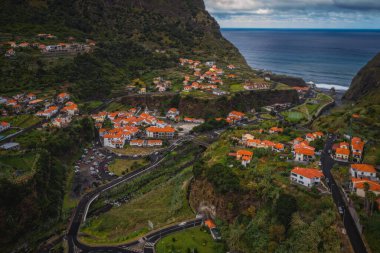Sao Vicente or San Vicente, Madeira, Portugal - October 2021: The fragment view of Sao Vicente village from mountain. Catholic church on front. Aerial drone picture