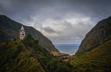Sao Vicente or San Vicente, Madeira, Portugal - October 2021: The fragment view of Sao Vicente village from mountain. Catholic church on front. Aerial drone picture