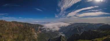 Panoramic view on mountain trail Pico do Arieiro, Madeira Island, Portugal. October 2021. Aerial drone picture. Clouds on mountains