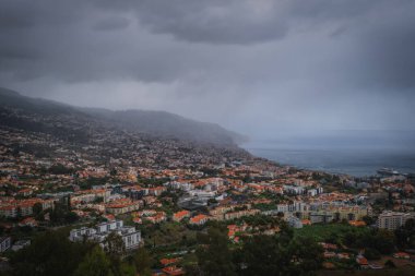Aerial panoramic view of Funchal city, Madeira, Portugal in foggy and rainy weather. October 2021
