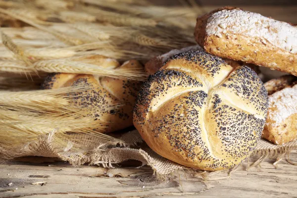 Bread and wheat on the wooden — Stock Photo, Image