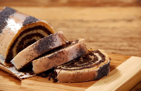 Poppy seed cake on wooden table — Stock Photo, Image