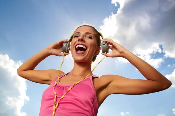 Beautiful woman listening to music — Stock Photo, Image