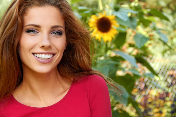 Beautiful woman in an autumn garden — Stock Photo, Image