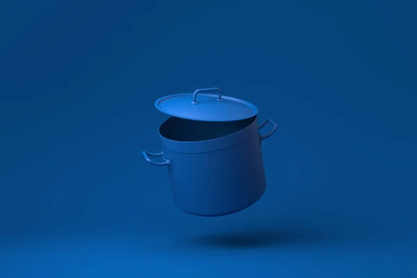 青の背景に浮かぶ青ステンレス製の鍋 創造性を最小限に抑えます モノクロだ 3Dレンダリング — ストック写真