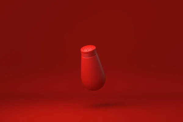 Red Pepper Shaker Плаває Червоному Фоні Мінімальна Концепція Творчої Ідеї — стокове фото