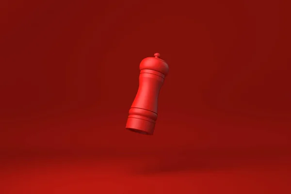 Red Pepper Mühle Schwimmt Rotem Hintergrund Minimale Konzeptidee Kreativ Monochrom — Stockfoto