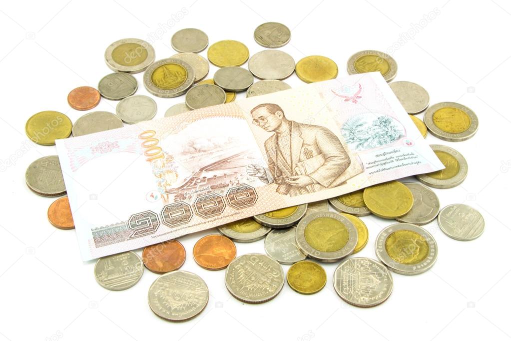 Thailand banknotes and coins isolated on white