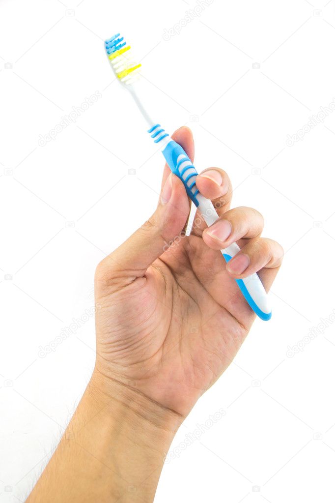 Men hand holding toothbrush