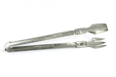 Serving tongs isolated on a white background clipart
