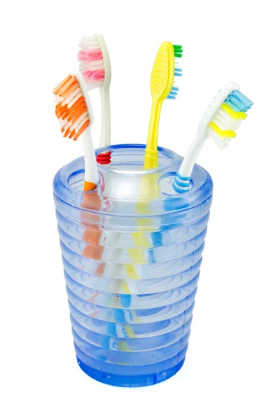 Several toothbrush put in storage and toothpaste — Stock Photo, Image
