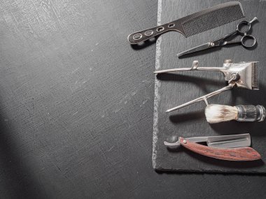 vintage barber tools dangerous razor hairdressing scissors old manual clipper comb shaving brush. on a black