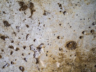 desenli gri beton arka plan çizik ve deliklerle bej kaplama.