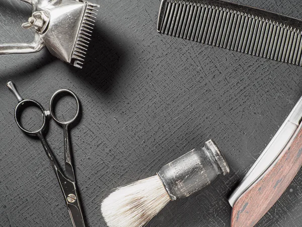 Vintage barber tools dangerous razor hairdressing scissors old manual clipper comb shaving brush. on a black — 图库照片