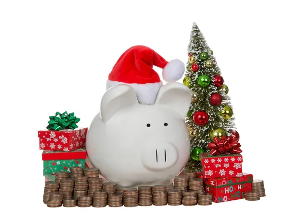 Witte Porseleinen Spaarpot Met Kerstmuts Omringd Door Stapels Geld Kwartjes — Stockfoto