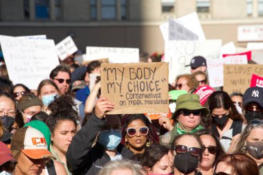 San Francisco, CA - May 3, 2022: Participants at Womens Rights Protest after SCOTUS leak, plan to overturn Roe v Wade. Holding signs protesting the leaked plan to overturn Roe v Wade.