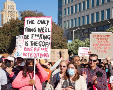 San Francisco, CA - May 3, 2022: Participants at Womens Rights Protest after SCOTUS leak, plan to overturn Roe v Wade. Holding signs protesting the leaked plan to overturn Roe v Wade.