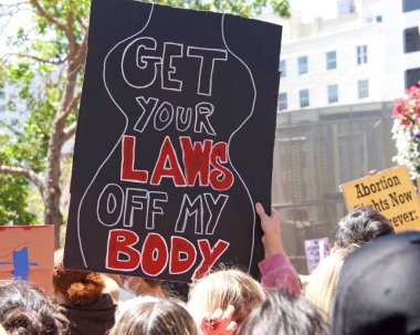 San Francisco, CA - May 7, 2022: Unidentified Participants holding signs marching in San Francisco at Women's Rights Protest after SCOTUS leak plan to overturn Roe v Wade. 