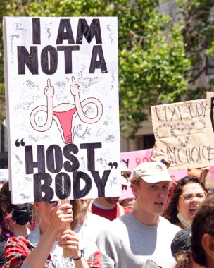 San Francisco, CA - May 7, 2022: Unidentified Participants holding signs marching in San Francisco at Women's Rights Protest after SCOTUS leak plan to overturn Roe v Wade. 