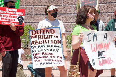 Alameda, CA - July 10, 2022: Participants at Youth Led rally at City Hall holding signs protesting SCOTUS overturning Roe, removing abortion rights.